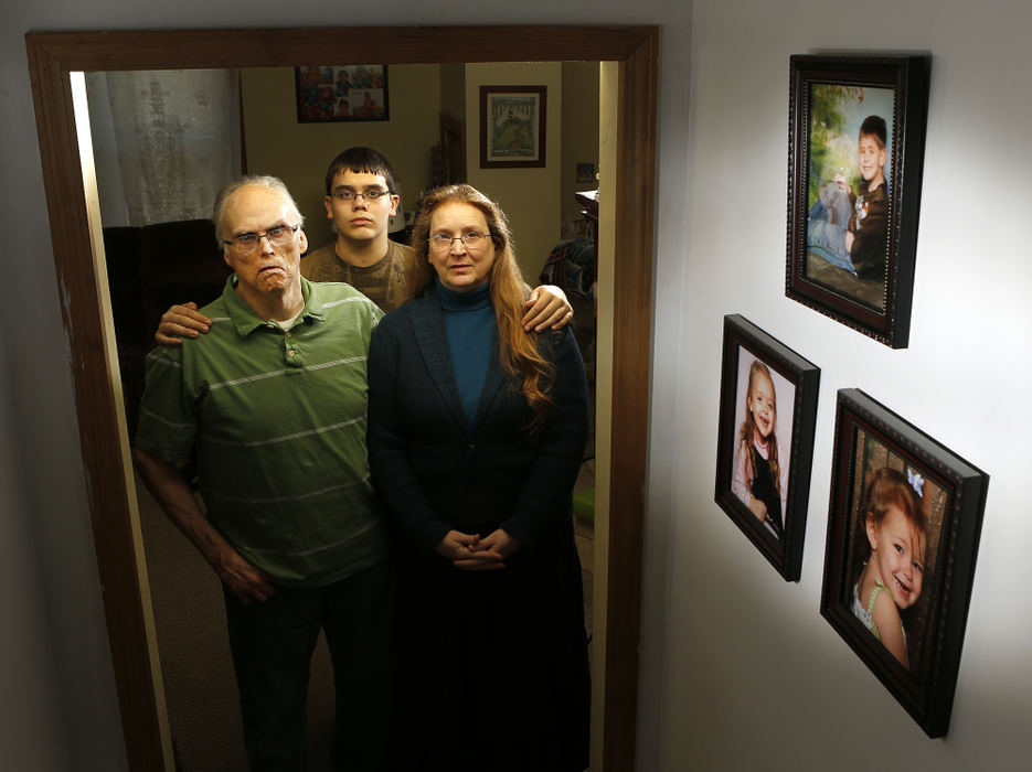 Portrait - 3rd placeSummer Inman's parents Mike (left) and Debbie Cook are now raising her children with the help of their son Joey (middle) at their home in Logan. In the photos on the right are Summer's children Alex (top), Kaley (left) and Alanna.  (Jonathan Quilter / The Columbus Dispatch)