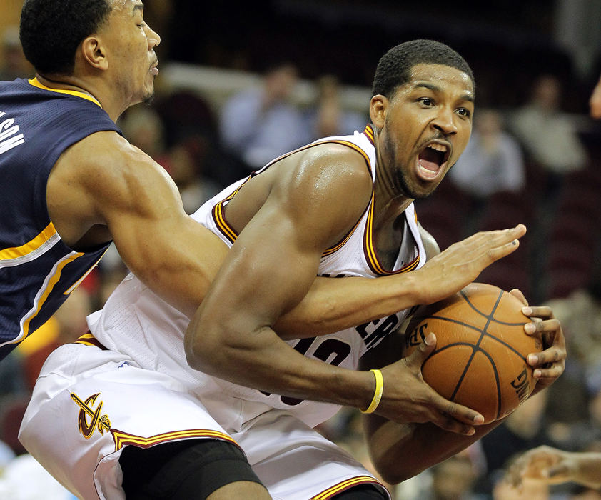 Sports - 3rd placeCleveland Cavaliers'  Tristan Thompson (right) protects the ball  in the fourth quarter during their game against the Indiana Pacers at Quicken Loans Arena. Indiana won 111-90.  (Lisa DeJong / The Plain Dealer)