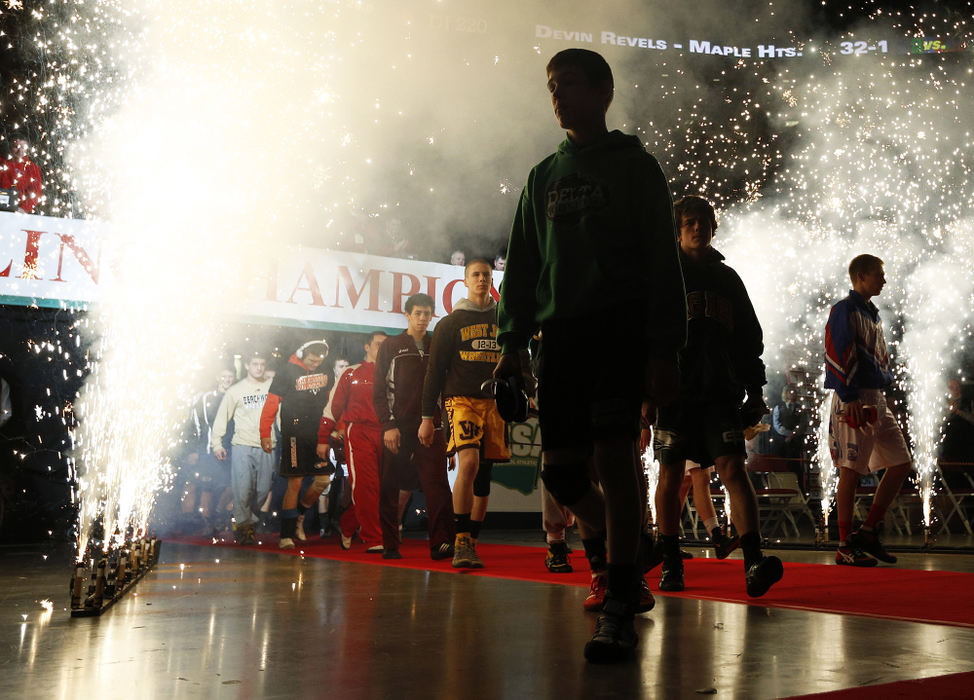 Story - 3rd placeWrestlers enter the stadium before the championship finals of the OHSAA State Wrestling Tournament at Value City Arena in Columbus High school wrestlers from all over Ohio converged on Columbus for three days and 1,260 matches to find out who would win the state championship in their division.  (Eamon Queeney / The Columbus Dispatch)