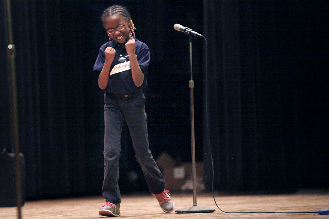 Feature - 1st place - Mariah Hendrix reacts after spelling 'tremble' correctly in the third grade spelling bee at Sandusky High School. (Angela Wilhelm / Sandusky Register)