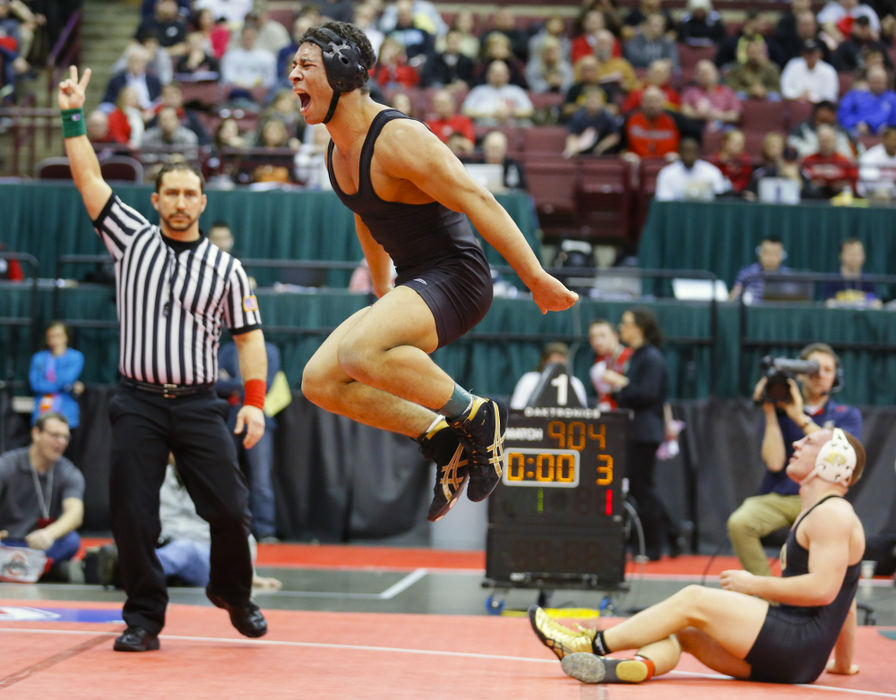 Sports Feature - 1st place - Casey Sparkman of Massilon Perry reacts after defeating Perrysburg wrestler J.P. Newton in their Division I 152-pound match during the championship semi-final round of the 77th annual state wrestling tournament at Ohio State University in Columbus. (Andy Morrison / The (Toledo) Blade)