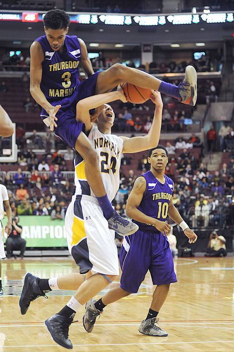 Sports - 2nd place - Jeff Thomas attempts to shoot the ball as Thurgood Marshall's Dwayne Chastain gets caught in his shot during the Division II state championship semi-final game in Columbus. (Angela Wilhelm / Sandusky Register)