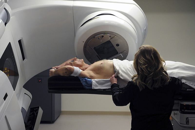 Feature - 1st place - Joe Batross of Zanesville,lies still while Jessica Ginikos, radiation therapy coordinator, preps him for a radiation therapy session at the Genesis Cancer Care Center in Zanesville. Batross was diagnosed with cancer earlier this year. (Shane Flanigan / Zanesville Times Recorder)