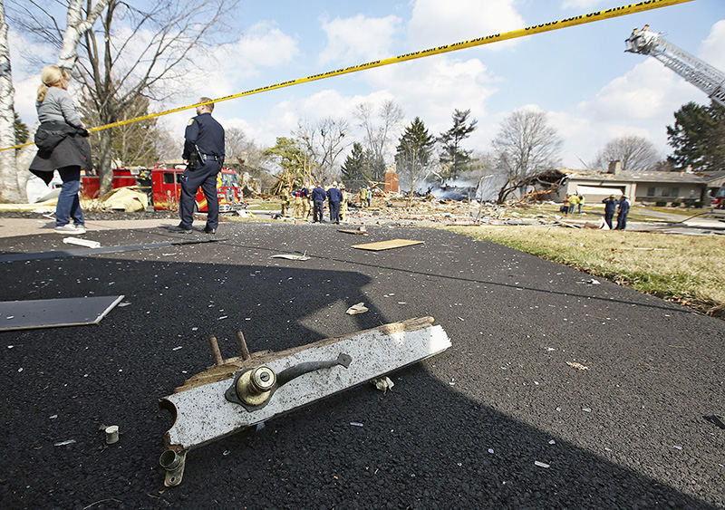 sSpot News - 1st place - The lock and handle from a home  that was destroyed by a gas explosion landed in the driveway of the neighbors across the street in Upper Arlington. (Chris Russell / The Columbus Dispatch)