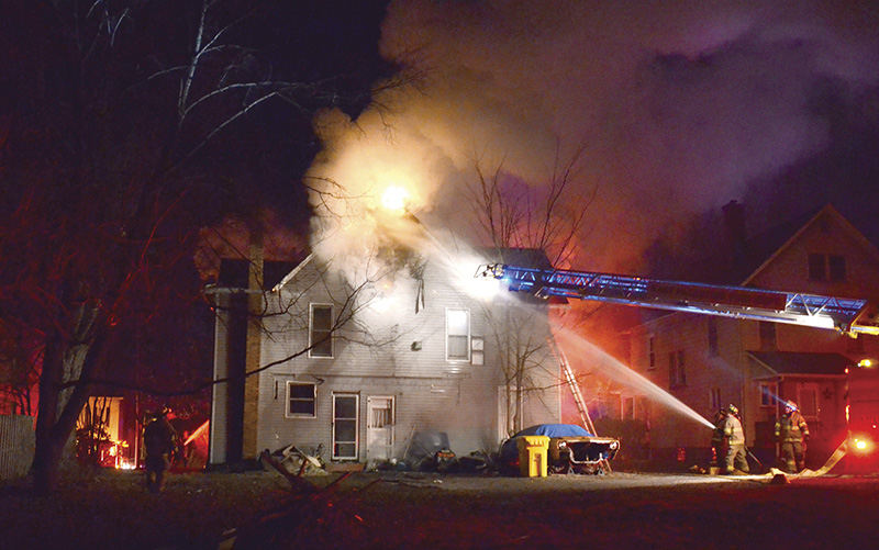 Spot News - 3rd place - A man and his two children safely escaped their burning home in East Palestine. Chief Josh Brown said Dustin Foley is listed as the occupant of the single-family home, and Foley discovered the fire that originated in the attic at the rear of the house. (Patricia Schaeffer / The (Lisbon) Morning Journal)