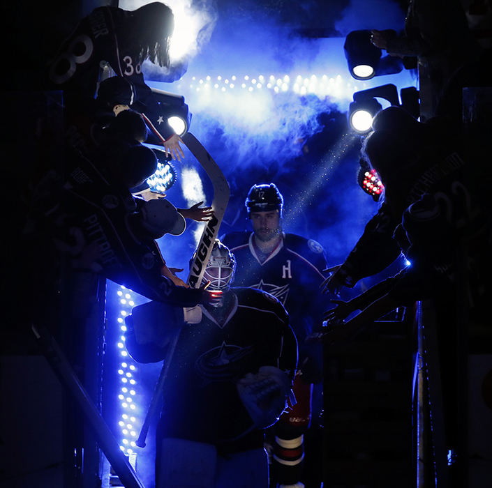 Sports Feature - 2nd place - Columbus Blue Jackets goalie Joonas Korpisalo leads his team on to the ice before their game against Detroit Red Wings at Nationwide Arena in Columbus. (Kyle Robertson / The Columbus Dispatch)