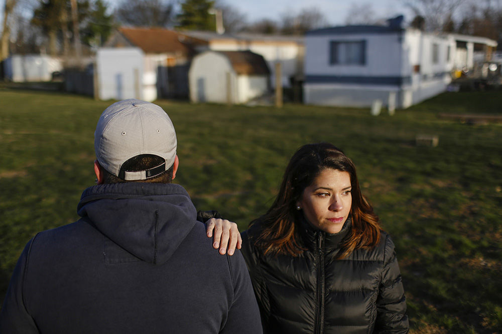 MTPortrait - 1st place - Immigration attorney Jessica Rodriguez Bell poses for a portrait with one of her clients, a mid-20s man who emigrated illegally from Mexico, at the mobile home park where he lives in northeast Columbus. When the man was 10 months old, he and his parents illegally immigrated from Mexico and they've spent the last 15 years living in this mobile home park where many other undocumented immigrants reside. During the last four years of the Obama administration, this man's immigration case became a low-priority under the Deferred Action for Childhood Arrivals policy, but he is concerned that he might become a higher priority for deportation under Trump administration policies.  (Joshua A. Bickel / The Columbus Dispatch)