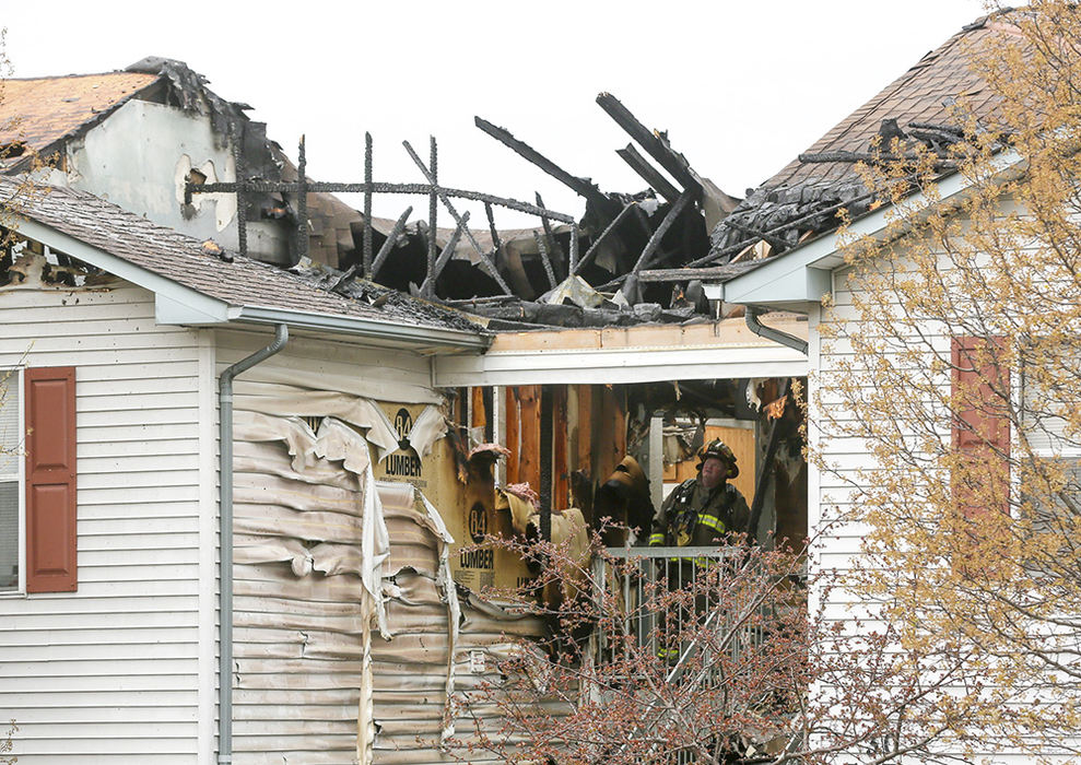 Spot News - 3rd place - West Chester Twp. fire department responded with mutual aid to a fire at the Meadow Ridge  apartment complex, near Muhlhauser Road in West Chester. Three people  suffered smoke inhalation and up to 10 families will be displaced due to the fire.  (Greg Lynch / Journal-News)