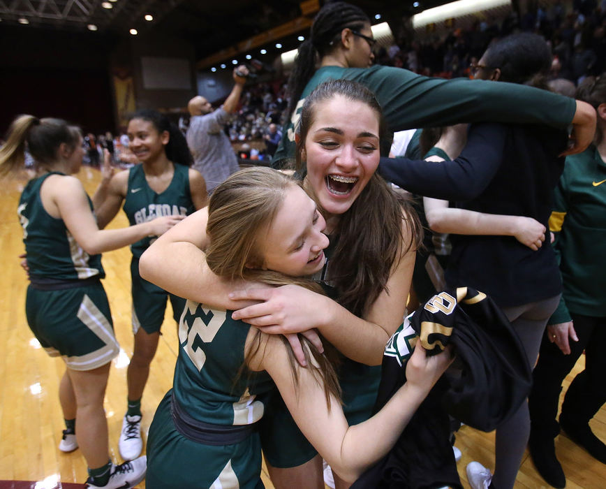 Sports Feature - HM - GlenOak’s Chloe Lindsey and Lexi Kleptach celebrate after defeating Eastlake North during their DIvision regional championship game at the Canton Civic Center. (Scott Heckel / The Canton Repository)