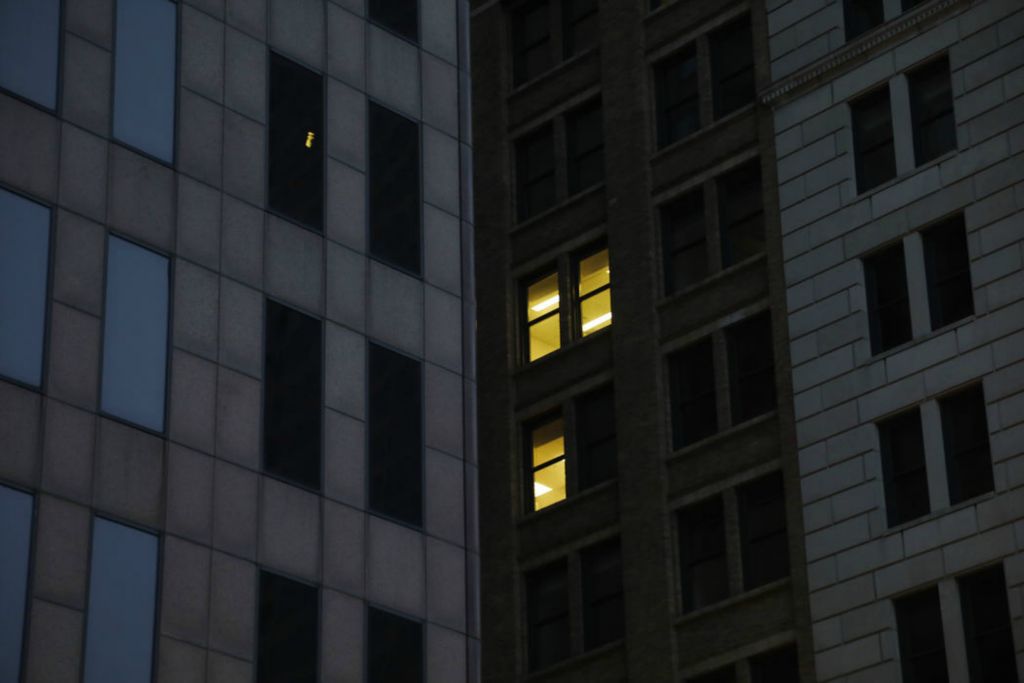 Illustration - 2nd place - A few lights on in the Huntington Center building in downtown Columbus.  When will companies in downtown starting allowing their employees back in office full time.    (Kyle Robertson / The Columbus Dispatch)