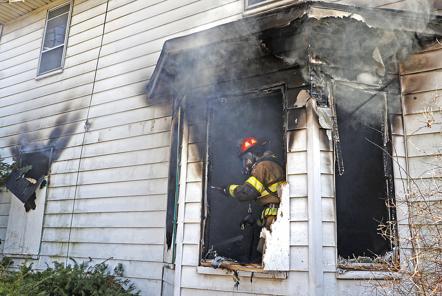 Spot News - 2nd place - The Springfield Fire Division battled a fire in a two story vacant house at 1301 Selma Road. According to fire officials, they received a call of heavy smoke coming from the house. When they arrived they found flames venting from the north side on the first floor where the bulk of the fire was contained. The house was vacant and had no electricity running to it. The cause of the fire is under investigation. Box 27 was also called to the scene to assist the fire department.  (Bill Lackey / Springfield News-Sun)