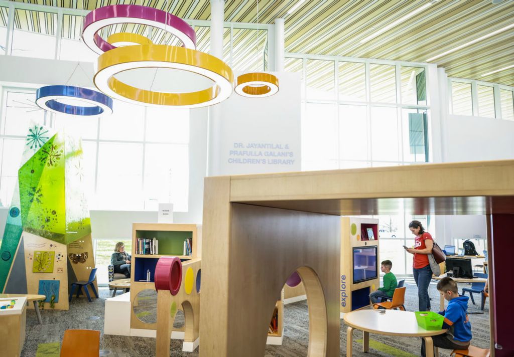 General News - 2nd place - Joellen Poncheri of Sylvania and her sons (from left) Christopher, 6, and Dominic, 8, explore the freshly renamed Dr. Jayantilal & Prafulla Galani’s Children’s Library inside the King Road Branch Library in Sylvania.   (Jeremy Wadsworth / The Blade)