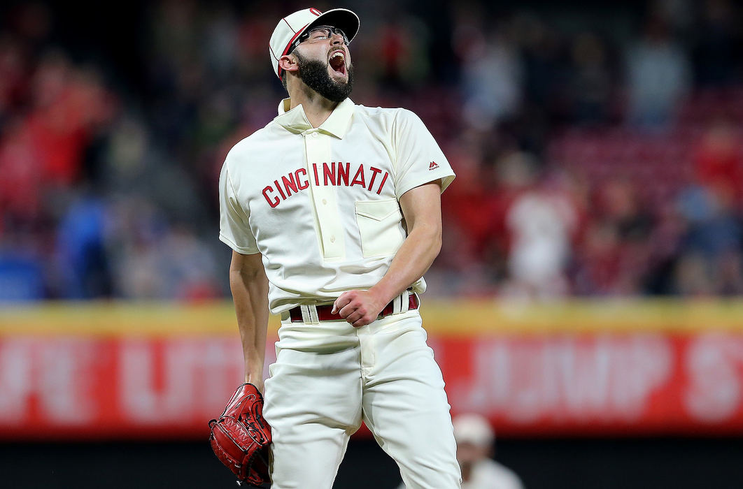 Sports Feature - HMCincinnati Reds pitcher Cody Reed (23) reacts after striking out the last batter of the game against the San Francisco Giants at Great American Ball Park in Cincinnati. Cincinnati won 9-2. (Kareem Elgazzar/The Cincinnati Enquirer)