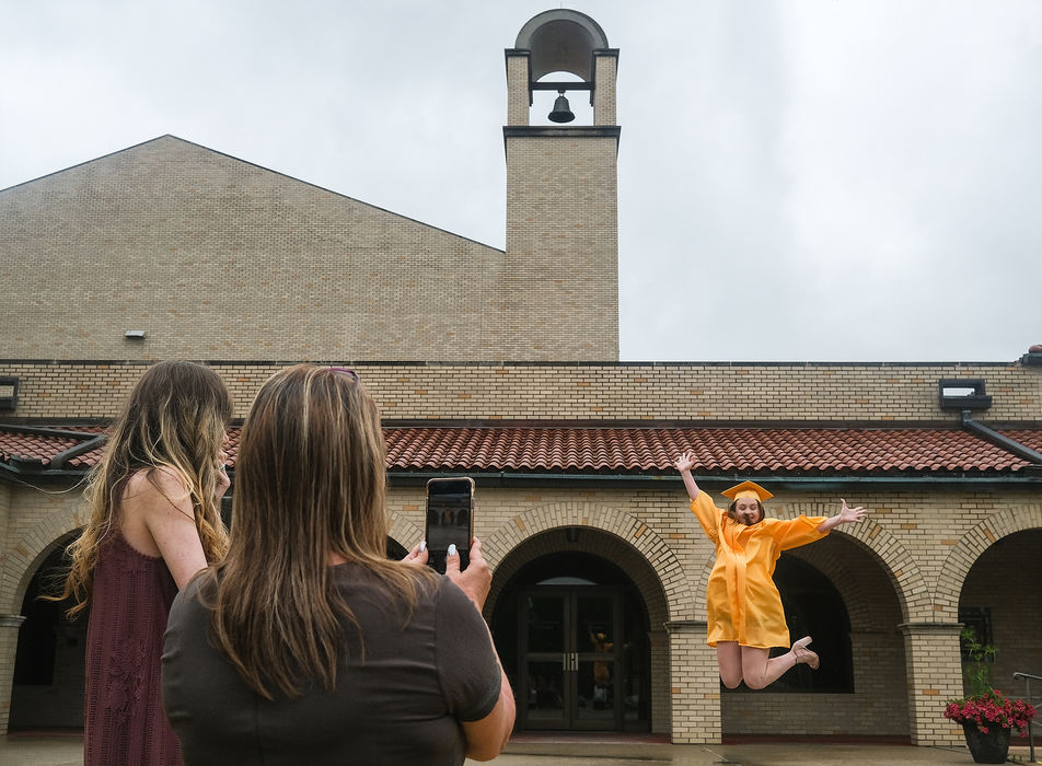 Feature - 3rd place - Breonna Sexton celebrates graduating from Sylvania Northview High School as family members take her picture in front of the Franciscan Center at Lourdes University in Sylvania, Ohio. Lourdes University plans to have in-person education in the fall as does the University of Toledo amid the coronavirus pandemic. Miss Sexton plans on attending UT.  (Jeremy Wadsworth / The Blade)