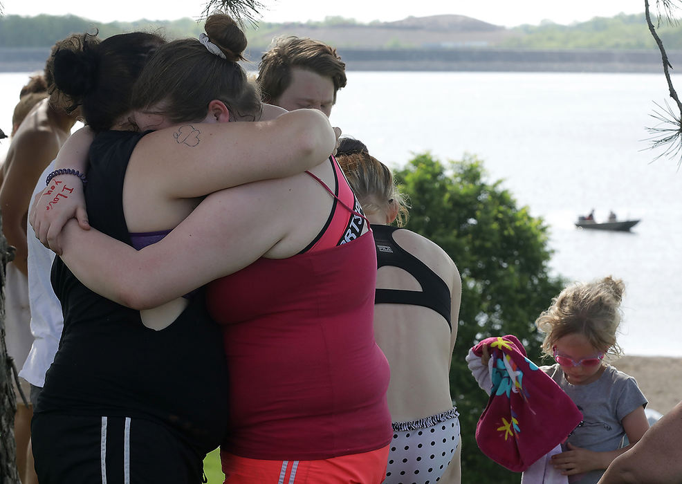 Spot News - 1st place - Two women console each other as crews search the water for a drowning victim at the beach at Buck Creek State Park.  (Bill Lackey / Springfield News-Sun)