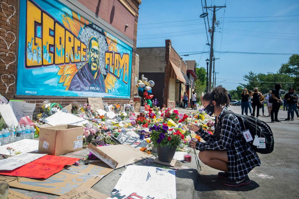 Story - 1st place - Malaysia Hammond, 17, prays as she puts flowers on George Floyd's memorial on East 38th Street and Chicago Avenue in Minneapolis, Minn. Protests erupted in Minneapolis on May 26 over the death of George Floyd who was killed by a Minneapolis Police officer.  (Rebecca Benson / The Blade)