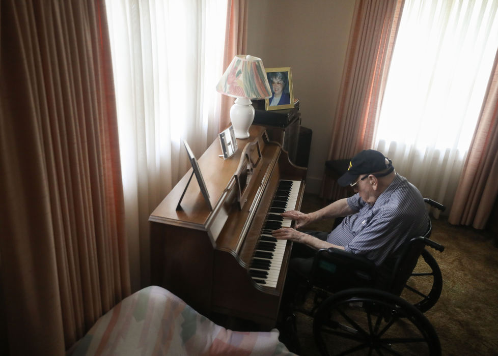 World War II veteran Thomas L. Maloney, 99, shares his musical talents on the piano at his home in Toledo. Maloney turned 100 on May 26. 