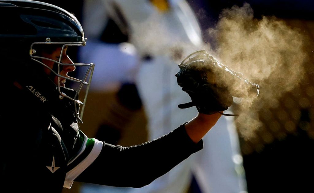 Ottawa Hills’ Blake Gnepper (2) catches a pitch during a game against Maumee at Maumee High School.