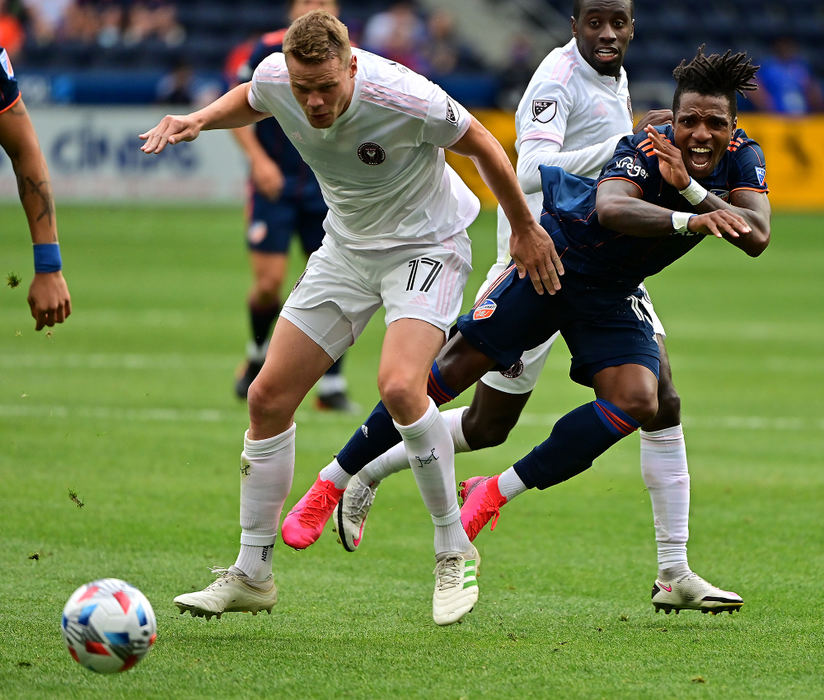 FC Cincinnati's Joseph Gyau gets tripped up by an Inter Miami Defender during the 1st half of at TQL stadium in CIncinnati. 