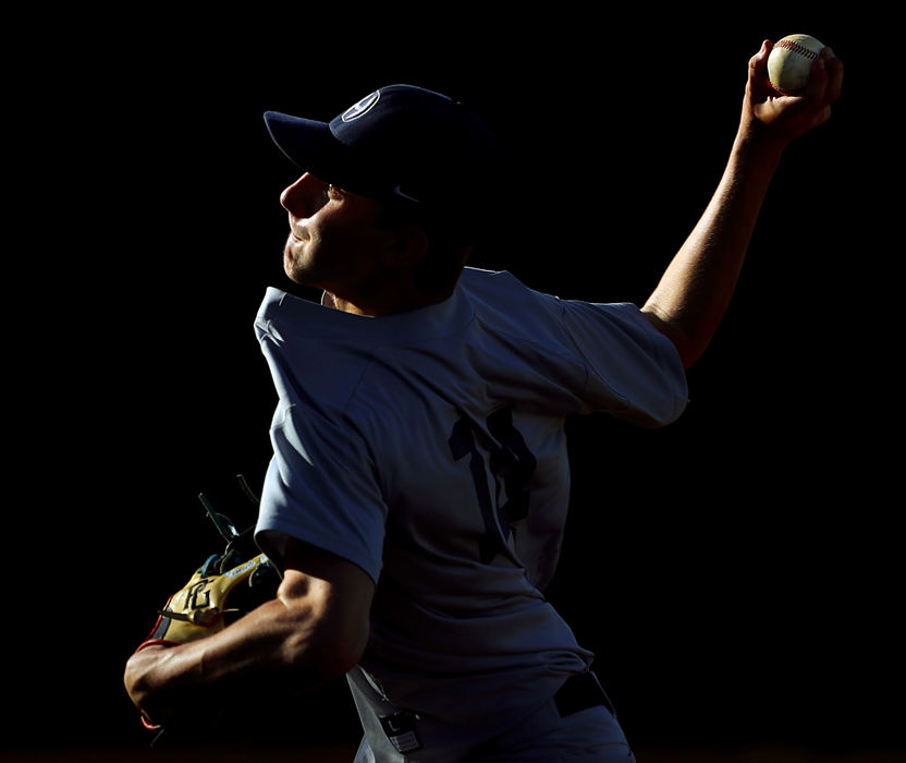 Hoban pitcher Noah LaFine delivers to a Triway batter during the fifth inning of a Division II district semifinal game at Revere High School.