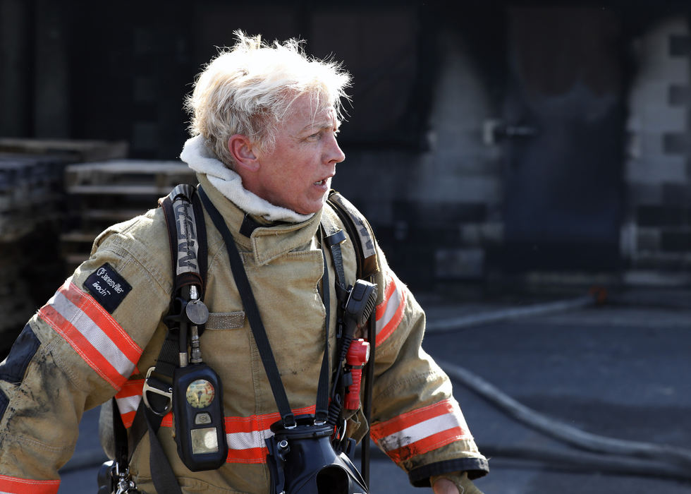 Columbus Division of Fire Assistant Chief Tracy Smith walks over to a group of students from Columbus State Fire Science after leading the group in a live burn practice at Ohio Fire Academy in Reynoldsburg. Smith also has earned her professional bodybuilder card.