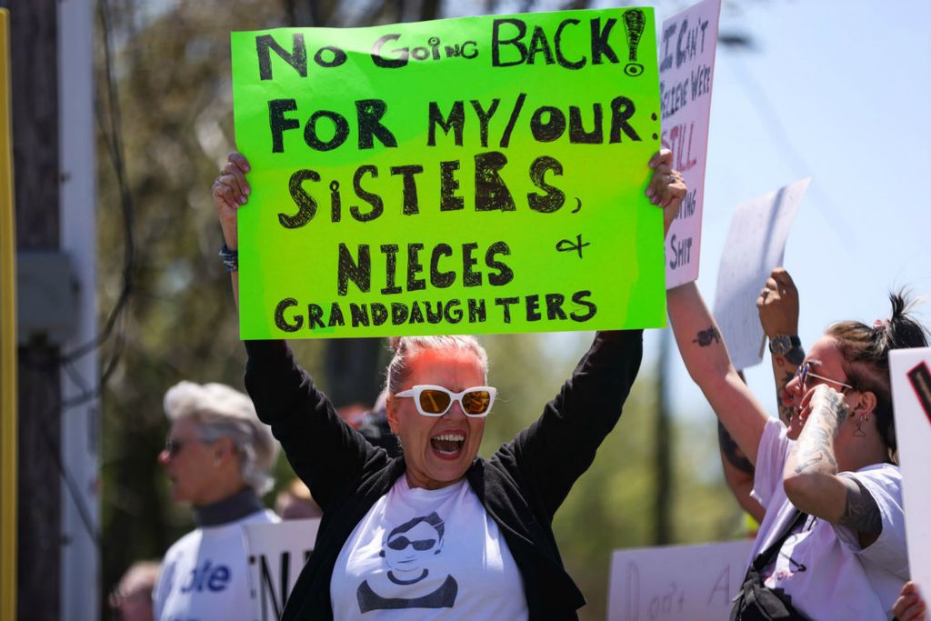 Story - 3rd place - Kathy Kujda chants on the corner of Secor and Central Avenue during the Mother's Day March for Choice in Toledo. (Rebecca Benson - The Blade)  