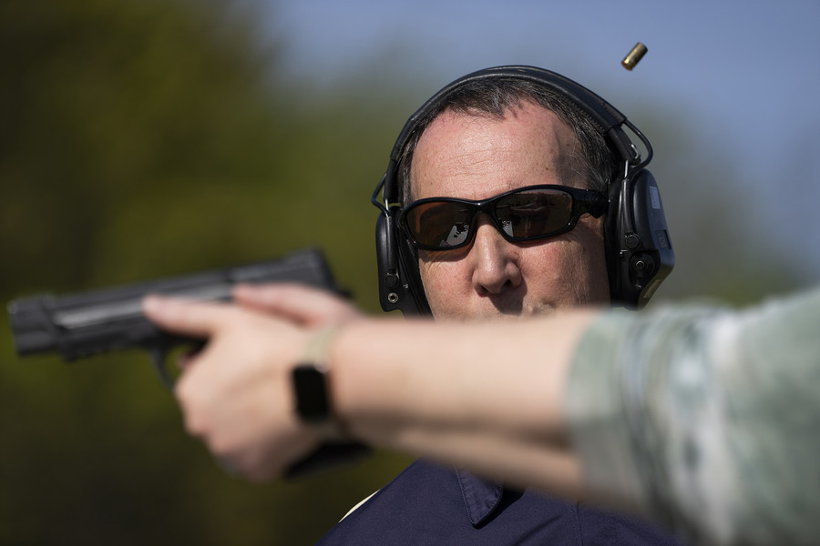 General News - 1st place - Jim Irvine gives instruction during the range instruction part of a concealed carry course. Trainees are required three hours of instruction on the range.   (Brooke LaValley / The Columbus Dispatch)