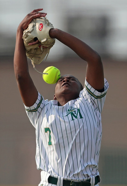 Sports - 2nd place - Akron St. Vincent - St. Mary’s right fielder Nori Talley drops a ball hit by Coventry’s Savannah Regan during the fourth inning in a Division II district final softball game at Willig Park in Canton. (Jeff Lange / Akron Beacon Journal)