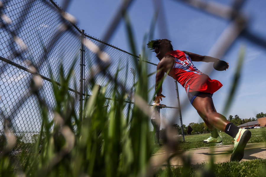 Sports - HM - Bowsher Blue Racers discus thrower Pierre Adams places first during a City League track and field meet at Rogers High School in Toledo. (Isaac Ritchey / The Blade)