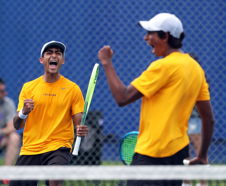 2nd -  Sports Feature - 3rd place - Rohan Sriram of Jackson (left) celebrates with his doubles partner Shiv Nagajothi as they win a set against the team of Xander Jhaveri and Rohit Jain of Westlake in their final match during the Division I district tennis tournament in Montrose. (Jeff Lange / Akron Beacon Journal)   (Jeff Lange / Akron Beacon Journal)