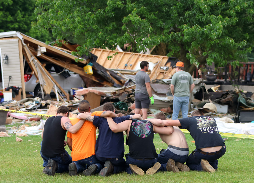 2nd -  Spot News - 1st place - A group of men kneel and console each other just outside the scene of a home explosion in Pike Township  in rural Fulton County. Two were killed and two were injured in the explosion.  (Kurt Steiss / The Blade)   (Kurt Steiss / The Blade)