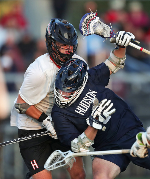 2nd -  Sports - 1st place - Hudson’s Ian Ludewig (right) crashes into Hoover’s Bryce Roach during the fourth quarter of a Division I regional lacrosse game in North Canton. (Jeff Lange / Akron Beacon Journal)   (Jeff Lange / Akron Beacon Journal)