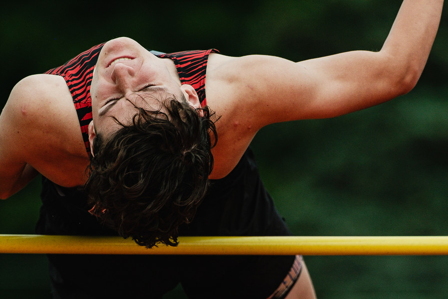 2nd -  Sports - 3rd place - New Philadelphia's Jaxon Rice competes in high jump during the OHSAA Division I district track & field meet at North Canton Hoover High School’s Memorial Stadium. (Andrew Dolph / The Times Reporter)   (Andrew Dolph / The Times Reporter)