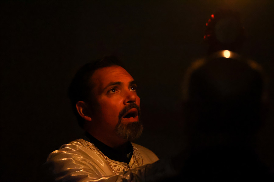 2nd -  Story - 3rd place - Father Larry Legakis raises a candle during a celebration of Orthodox Easter at the Holy Trinity Greek Orthodox Cathedral on Sunday, May 5, in Toledo.  (Jonathan Aguilar / The Blade)   (Jonathan Aguilar / The Blade)