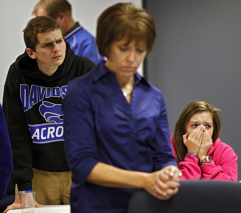 General News - 3rd place - Hilliard Davidson seniors Heath Flowers (left) and Monica Lince (right) react after finding out Hilliard City Schools levy failed by 6 votes. In front is Bobbi Mueller, co-chairwoman of For Hilliard Schools. (Kyle Robertson / The Columbus Dispatch)