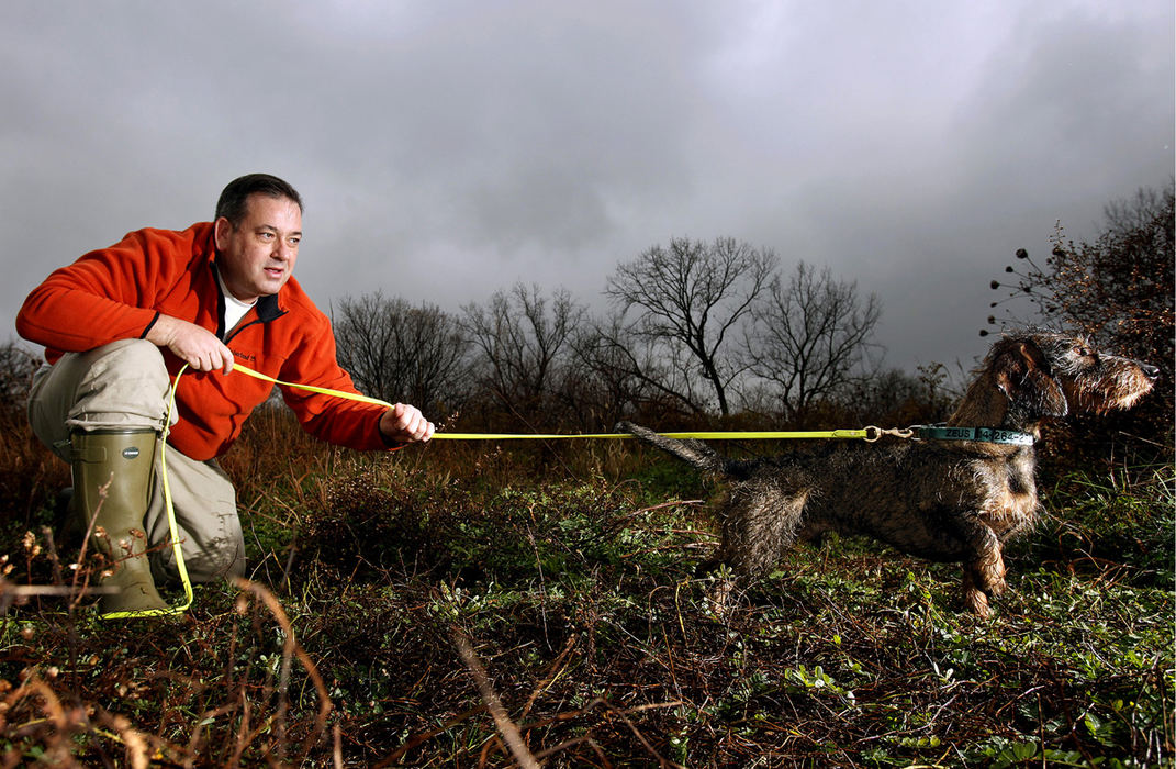 Portrait - 3rd place - Pat McCaffrey, a Columbus lawyer, and his blood-tracking dog, Zeus, track down deer that wander off after being wounded by hunters. (Kyle Robertson / The Columbus Dispatch)