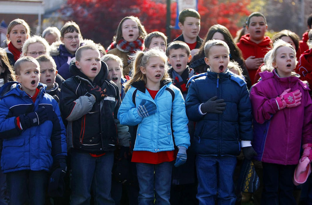 Story - HM - Students from St. Paul's Lutheran School sing the National Anthem at the beginning of the Voices from the Stone program at the Union County Veterans Memorial Plaza in Marysville. (Jonathan Quilter / The Columbus Dispatch)