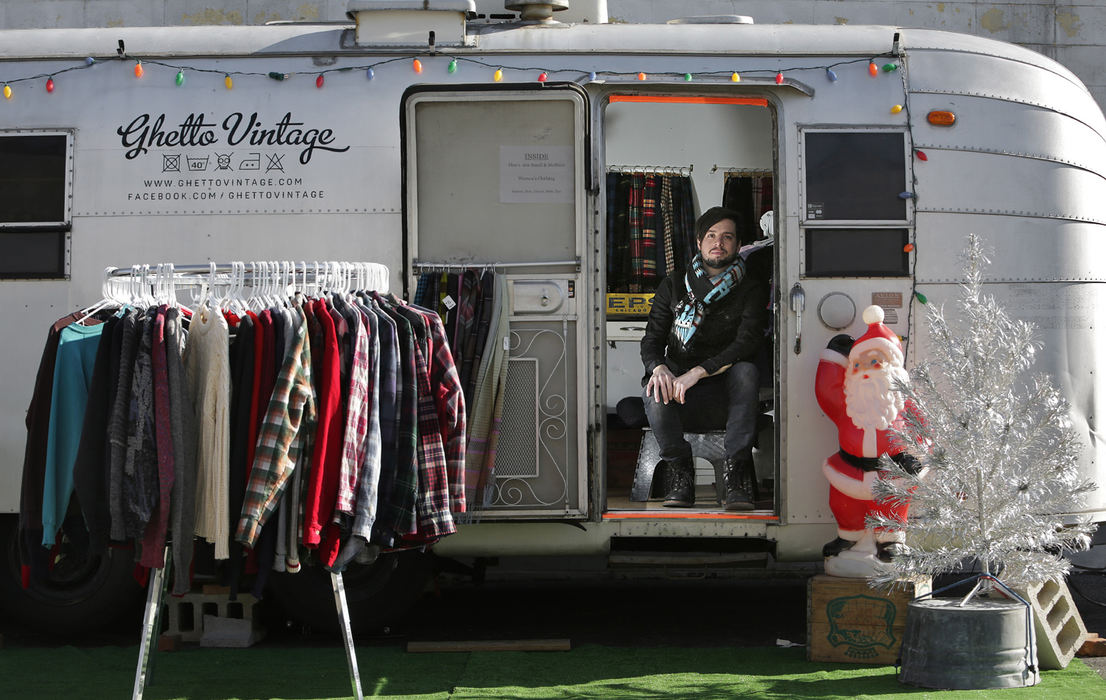 Portrait - 1st placeJosh Harden and his mobile vintage clothing shop at rest in its storage space on the east side of Columbus.  Harden usually does business setting up at night at Gallery Hop and other public venues.   (Chris Russell / The Columbus Dispatch)