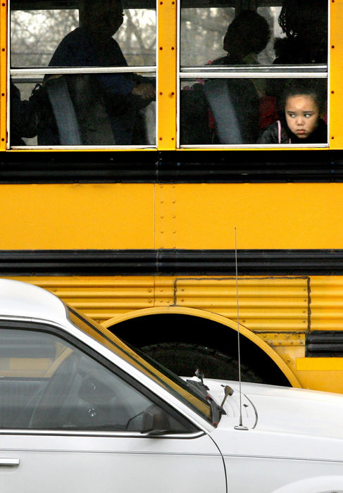 Spot News - 3rd placeA student looks out the window of a Canton City School bus which struck a parked car at the corner of 10th Street and Ross NE in Canton. School children were onboard the bus at the time although no on was injured. (Scott Heckel / The Repository)