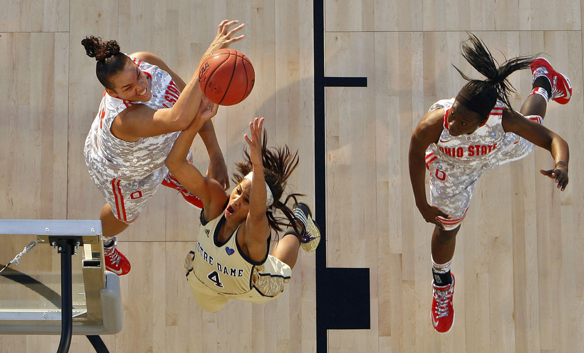 Sports - 1st placeOhio State center Ashley Adams (33) blocks the shot of Notre Dame Fighting Irish guard Skylar Diggins (4) during the 1st half of the Carrier Classic on the Yorktown Carrier in Charleston, S.C.   (Kyle Robertson / The Columbus Dispatch)