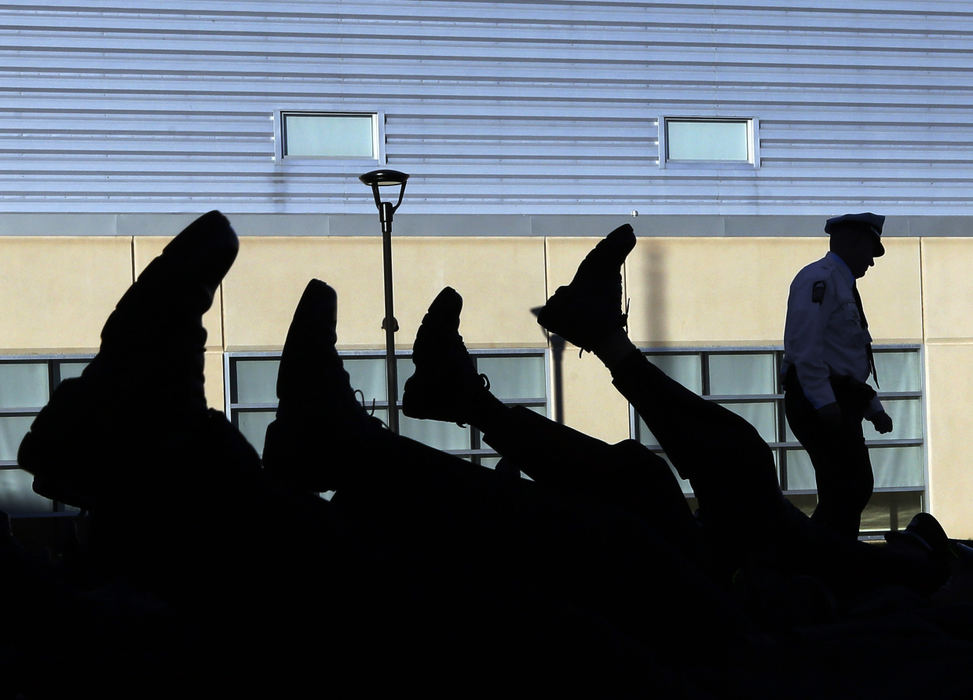 General News - 3rd placeMembers of the 121st Columbus police recruit class drop out of formation to to do push ups and leg lifts after the flag was not lowered properly at the end of the a training day at the Columbus Police Academy. (Eric Albrecht / The Columbus Dispatch)