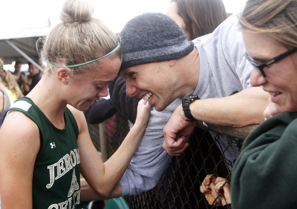 Sports Feature - 2nd placeDublin Jerome's Carly Davis receives some words of encouragement from coach Ken Schuster following the Division I state cross country meet at National Trail Raceway. (Lorrie Cecil / ThisWeek Newspapers)