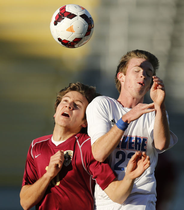 Sports - 3rd placeMichael Gilbert (left) of Bishop Watterson and Luke Kasson (23) of Revere compete for a ball during the OHSAA Division II state soccer championship game at Columbus Crew Stadium. Revere won the game 2-0.  (Barbara J. Perenic / The Columbus Dispatch)