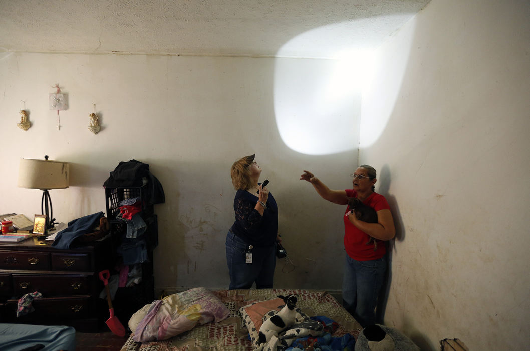 Story - 1st placeRenter Elizabeth Hall shows off the upstairs bedroom with bedbugs to Columbus Code officers Danielle Weber at 154 Midland Ave. in Columbus during an inspection.  Renter Elizabeth Hall called Columbus code enforcement to report problems with the house. Code officers showed up 3 weeks later.   (Kyle Robertson / The Columbus Dispatch)