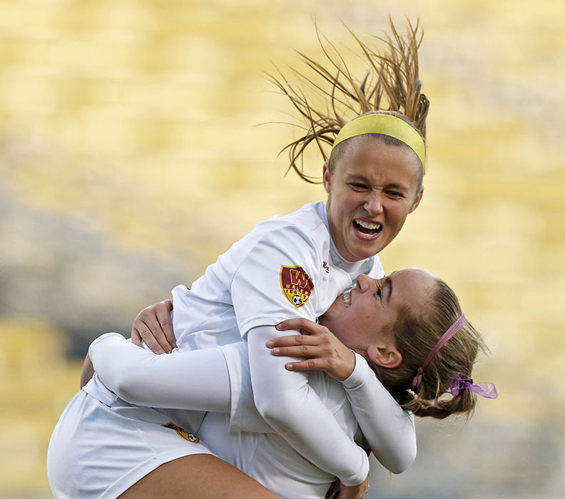 Sports Feature - 2nd place - Juli Knapp (13) and Caitllin Glascott (19) of Walsh Jesuit celebrate a goal over Dublin Coffman in the OHSAA Division I state championship soccer game at Crew Stadium in Columbus.  (Barbara J. Perenic / The Columbus Dispatch)