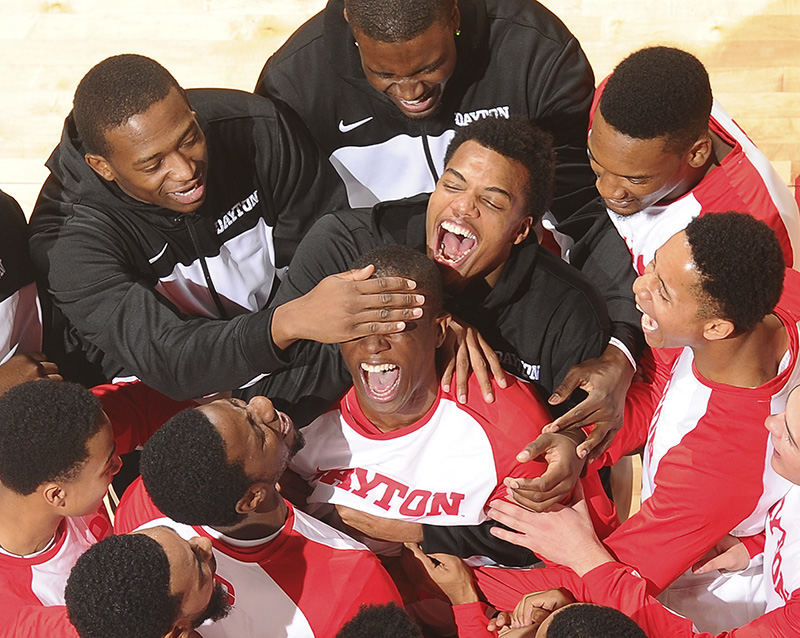 Sports Feature - 3rd place - Dayton's Jordan Sibert has his eyes covered by a team mate as he is introduced into the starting line up prior to the start of the Dayton Flyers vs Alabama A&M basketball game at UD Arena. (Erik Schelkun / Elsestar Images)