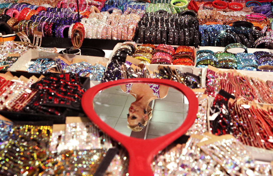 Feature - HM - Lynda Hamilton from Toronto Canada picks out jewelry to go with her ballroom dance outfit at the Columbus Convention Center. Columbus is hosting the Ohio Star Ballroom Championships. (Eric Albrecht / The Columbus Dispatch)