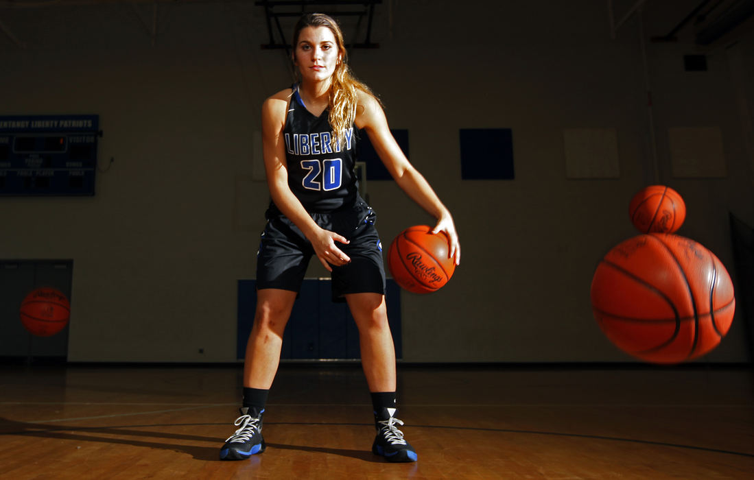 Portrait - 1st place - Olentangy Liberty High School senior basketball player Alexa Fisher poses for a portrait in the gym in Powell. Fisher is on the comeback trail from knee reconstruction surgery and foot surgery and is awaiting to be cleared to play. (Leah Klafczynski / The Columbus Dispatch)