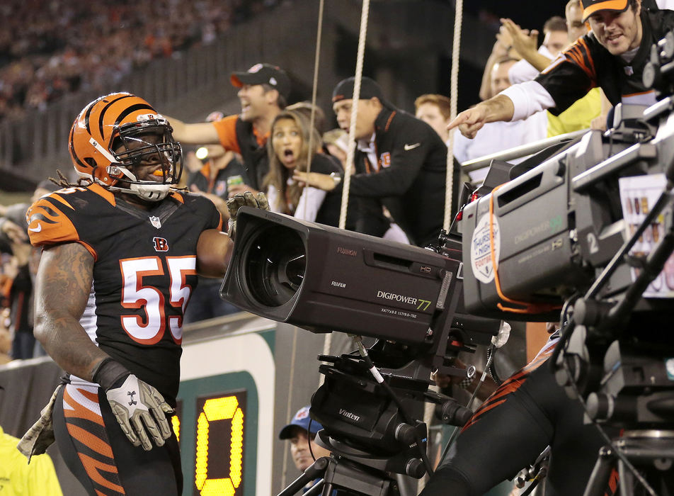 SSports Feature - 1st place - Cincinnati Bengals outside linebacker Vontaze Burfict (55) and free safety Reggie Nelson (20) crash into a broadcast camera, knocking it to the ground in the first quarter against the Cleveland Browns at Paul Brown Stadium in  Cincinnati. (Sam Greene / Cincinnati Enquirer)