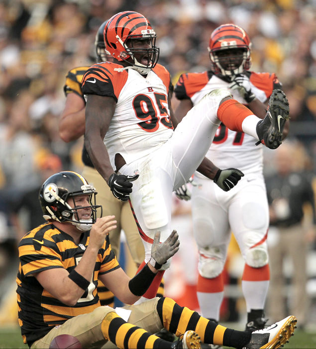 SSports Feature - HM - Cincinnati Bengals defensive end Wallace Gilberry (95) celebrates after sacking Pittsburgh Steelers quarterback Ben Roethlisberger in the fourth quarter at Heinz Field in Pittsburgh. (Sam Greene / Cincinnati Enquirer)